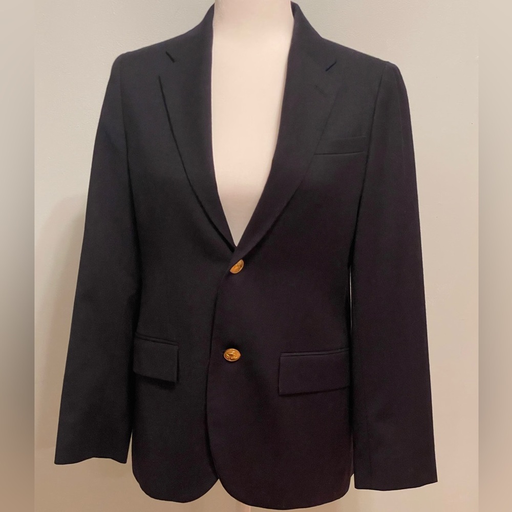 Boy’s navy blazer size 14-16. Gold buttons.